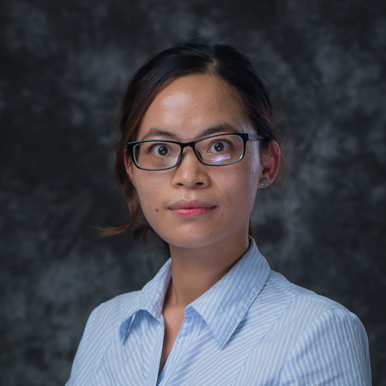 Portrait of Belinda Zhu, a Guidance Department Assistant at Clifford International School in Panyu, Guangzhou, China